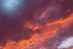 Beautiful purple blue sunset sky with cumulus clouds. Natural background. Copy space photo