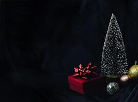 Christmas background, red gift box and ornaments. photo