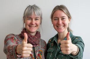 AI generated Two women happily showing thumbs up against a plain white background, acceptance image photo