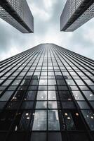 AI generated image shows tall skyscraper reaching into an overcast sky. The building is constructed with reflective glass panels that mirror the surrounding buildings and sky Ai Generated photo