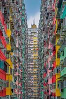 AI generated image captures densely packed, colorful apartment building with balconies. Ai Generated photo