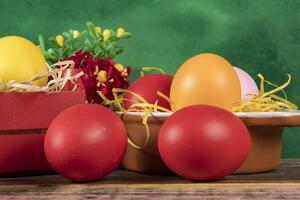 eggs in wooden box with hay on rustic background or surface, easter or holiday concept photo