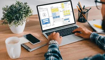 Man Creating UX UI design process for modish mobile application and website . Creative prototype of wireframe for professional app developer . photo
