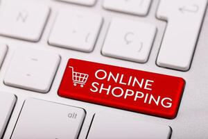 computer keyboard button with shopping cart symbol - online shopping concept photo