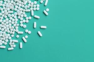 AI generated Pharmaceutical pills on mint background  Minimalistic medicine concept. photo
