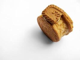 Cromboloni, New York Roll Croissant with biscoff topping, isolated white background. photo