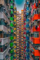 AI generated image captures densely packed, colorful apartment building with balconies. Ai Generated photo