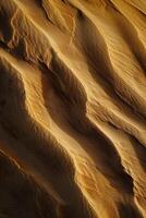 AI generated image captures the detailed textures and patterns on sand dune. The dune has ridges and valleys Ai Generated photo