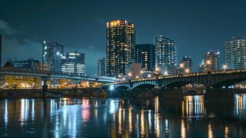 AI generated nighttime cityscape featuring tall buildings, a bridge, and a river Ai generated photo