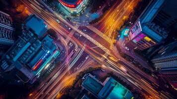 ai generado imagen es un aéreo ver de ocupado ciudad intersección a noche. múltiple carreteras converger a esta punto, creando un intrincado modelo marcado por varios carriles y cruces de peatones. ai generado foto