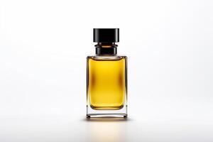 Yellow perfume bottle with black lid on white background photo