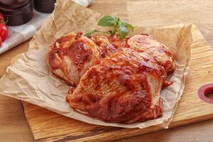 Marinated chicken leg in tomato sauce photo