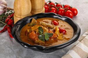 Yellow Thai curry with beef photo