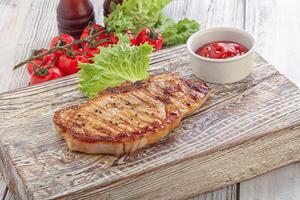 Grilled pork steak with ketchup photo