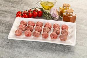 Uncooked raw beef meatball minced photo