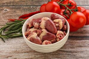 Raw chicken hearts for cooking photo