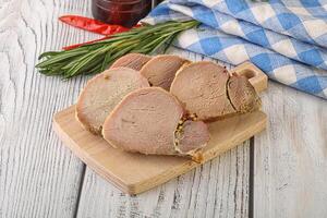 Baked pork tenderloin served rosemary photo