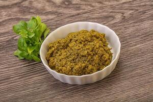 Green sauce pesto with basil photo