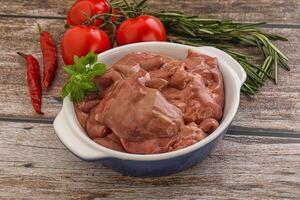 Raw chicken liver in the bowl photo