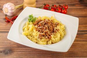 Bolognese pasta with beef meat and cheese photo