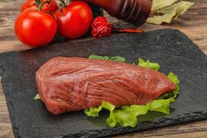 Raw beef cut for cooking photo