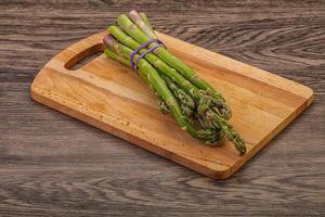 Vegan cuisine - Raw asparagus heap photo