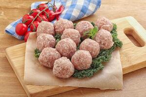 Raw pork meatball for cooking photo