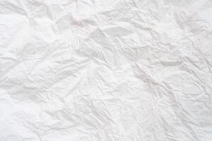 Wrinkled or crumpled white stencil or tissue paper used for crumpled paper background texture. photo