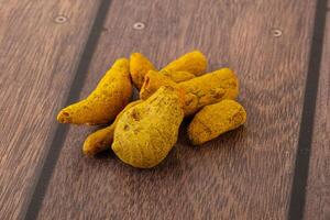 Indian spices - Turmeric root Curcuma photo