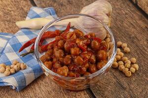 Baked chickpea with tomato sauce photo