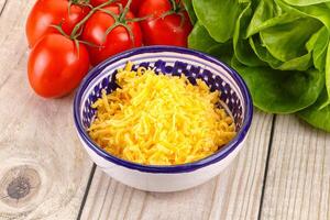 Shredded cheese in the bowl photo