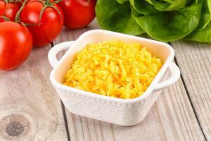 Shredded cheese in the bowl photo