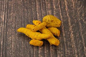 Indian spices - Turmeric root Curcuma photo