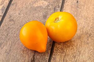 Ripe yellow bright juicy tomato photo