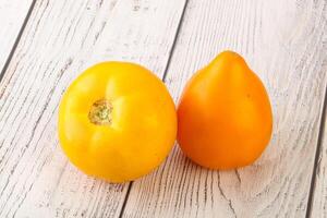 Ripe yellow bright juicy tomato photo