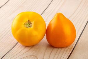 Ripe yellow bright juicy tomato photo