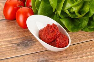 Tomato puree sauce for cooking photo