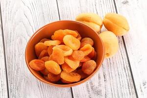 Dried apricot heap in the bowl photo