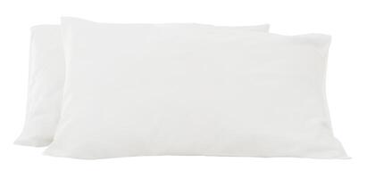 White pillows in stack after guest's use in hotel or resort room isolated on white background with clipping path.  Concept of comfortable and happy sleep in daily life photo