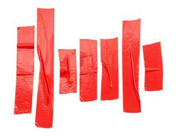 Top view of red adhesive vinyl or cloth tape stripes in set isolated on white background with clipping path photo