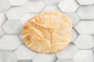 Traditional eastern round pita bread photo