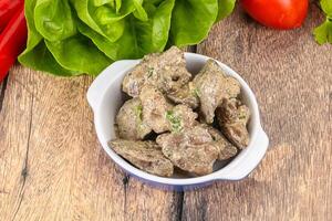 Chicken liver with cream sauce photo