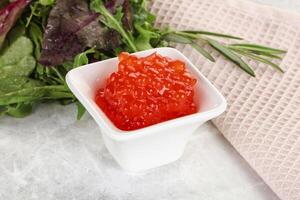 Red caviar in the bowl photo