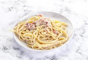 Classic pasta carbonara with bacon photo