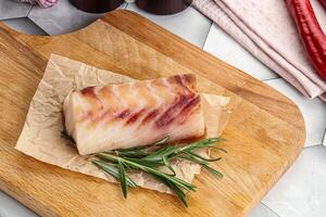 Raw cod fish steak for cooking photo