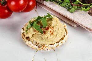 Crispbread with arabic creamy hummus photo