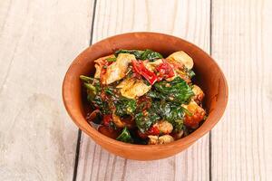 Chicken with tomato and spinach photo