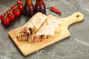 Shawarma with grilled chicken meat photo