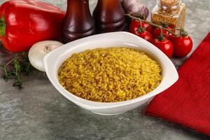 Dry wheat bulgur cereal heap photo