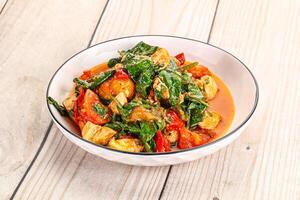 Chicken with tomato and spinach photo